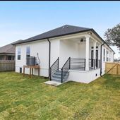 Spacious home with tall ceilings and wooden floors.